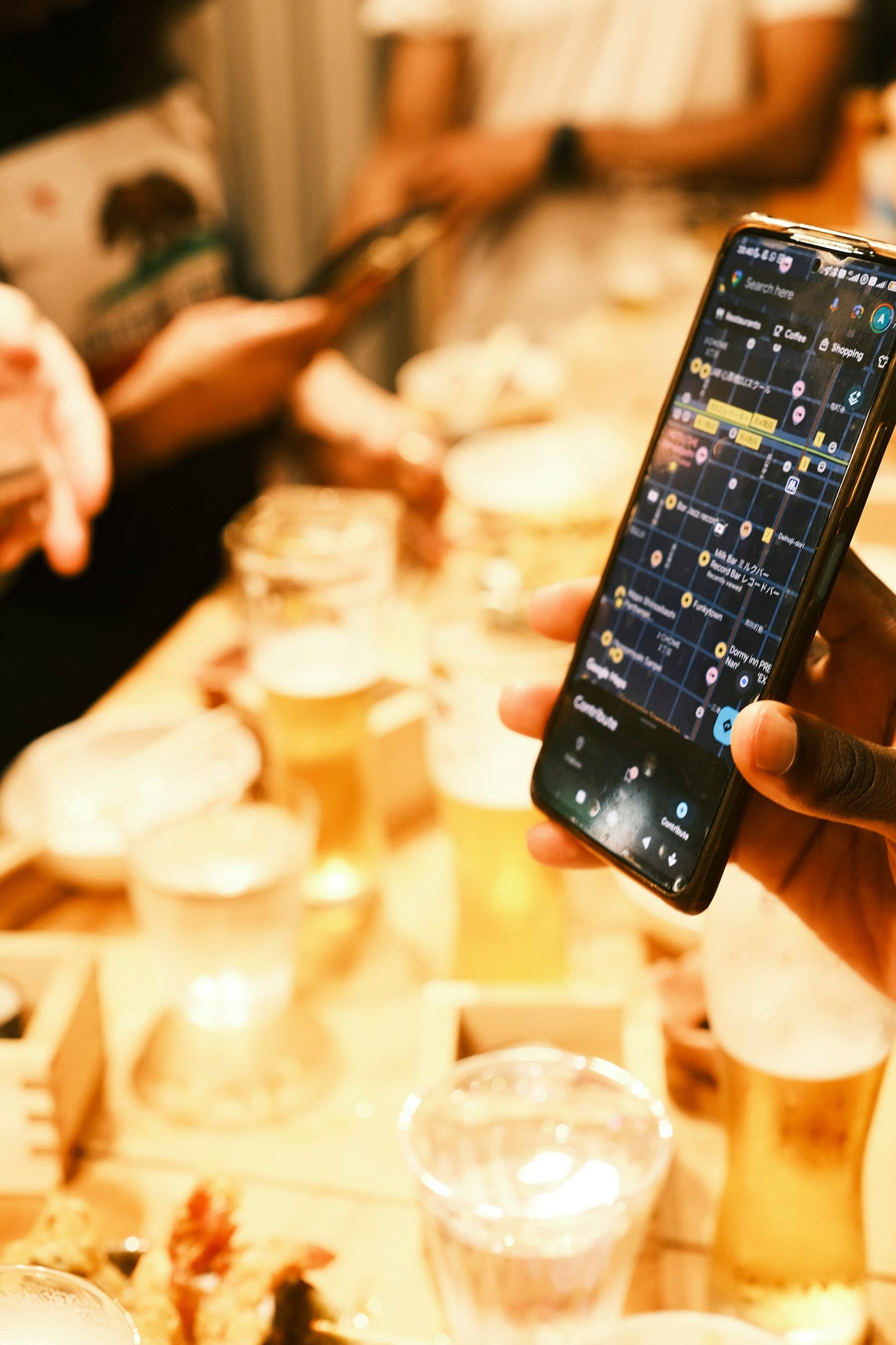 Traveler comparing smartphone connectivity options at a table during an international trip.