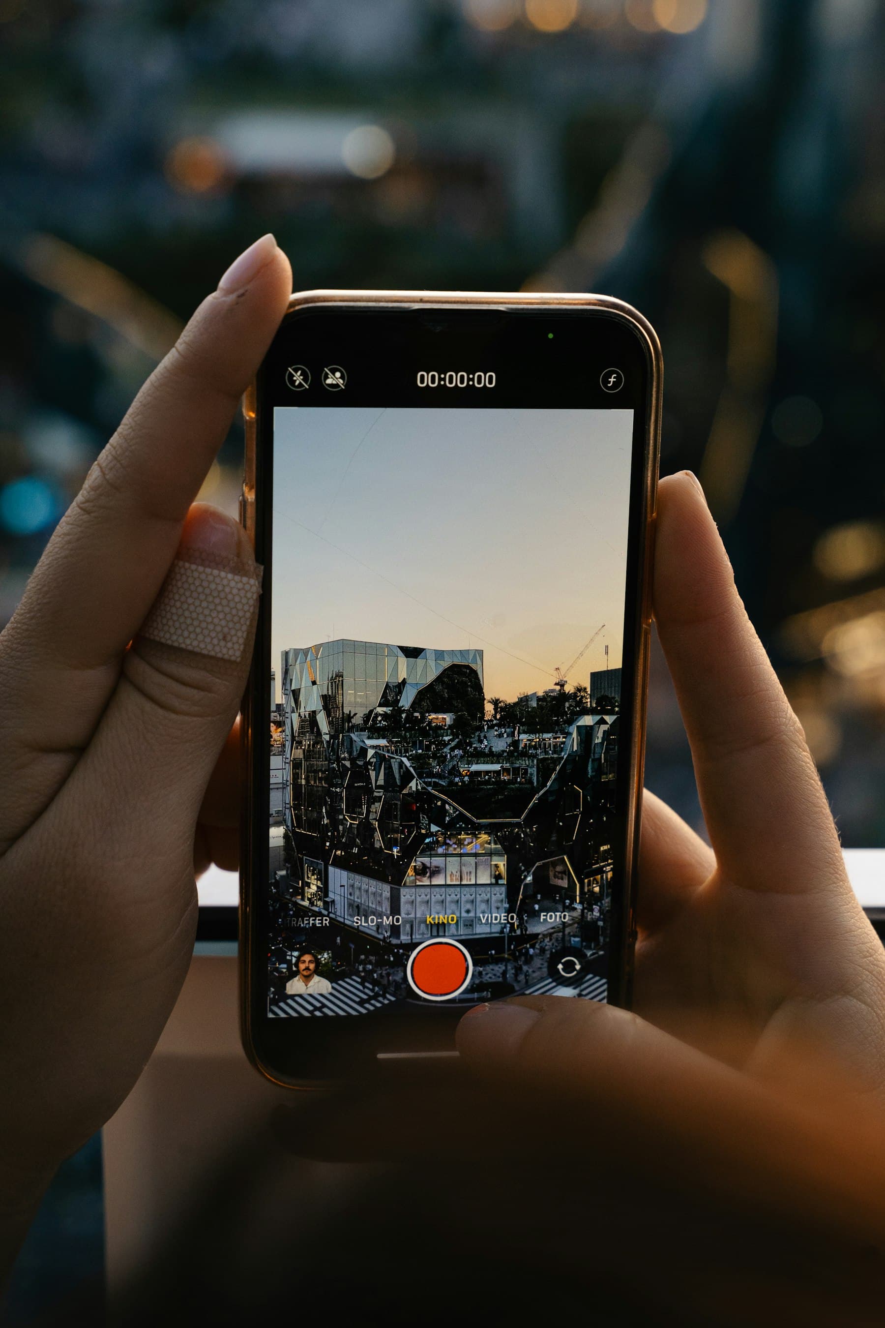 Traveler documenting a city connectivity check with a smartphone camera.